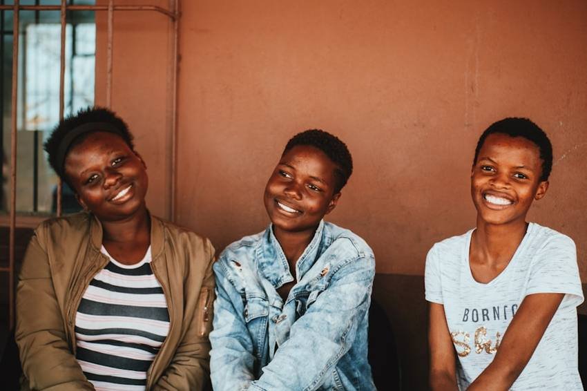 Three young women from the community laughing together